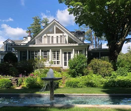 House exterior with pool and trees
