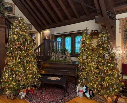 living room with christmas trees